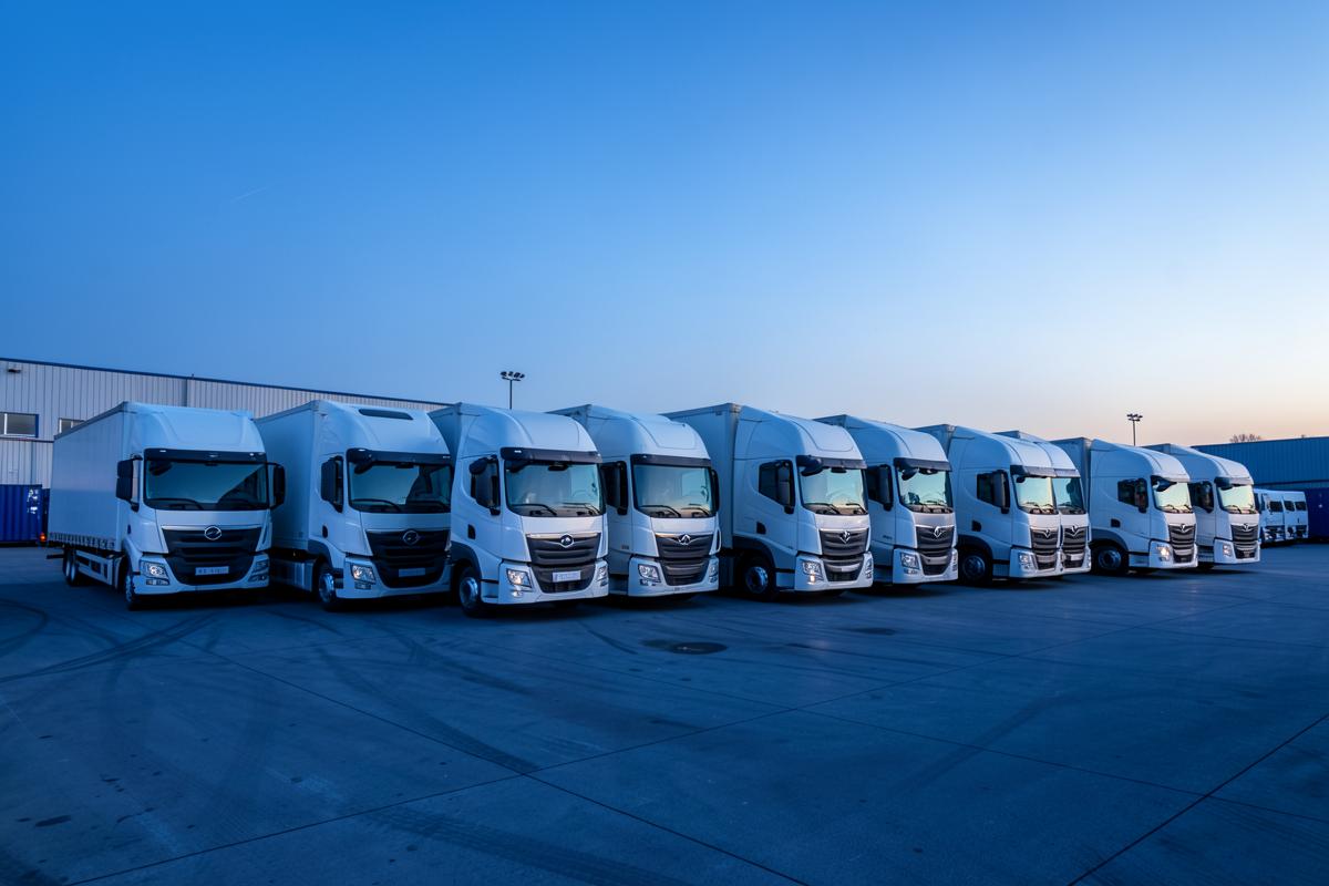 Trucks parked at a logistics yard at dawn